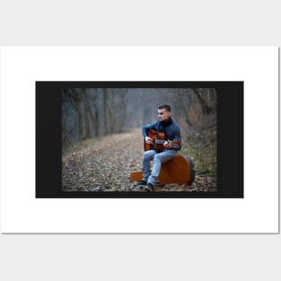 Guitarist singing outdoor in the forest Posters and Art